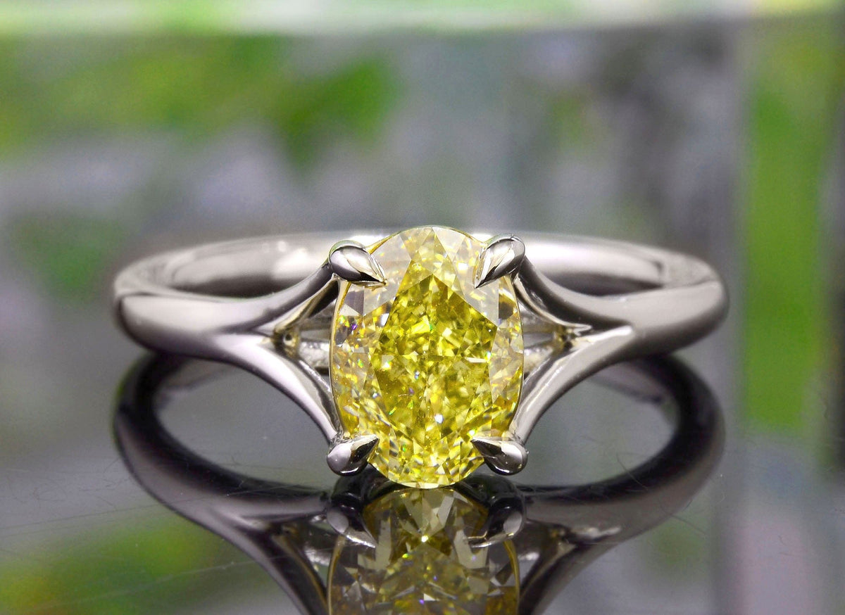 Canary fancy yellow oval cut split shank diamond ring