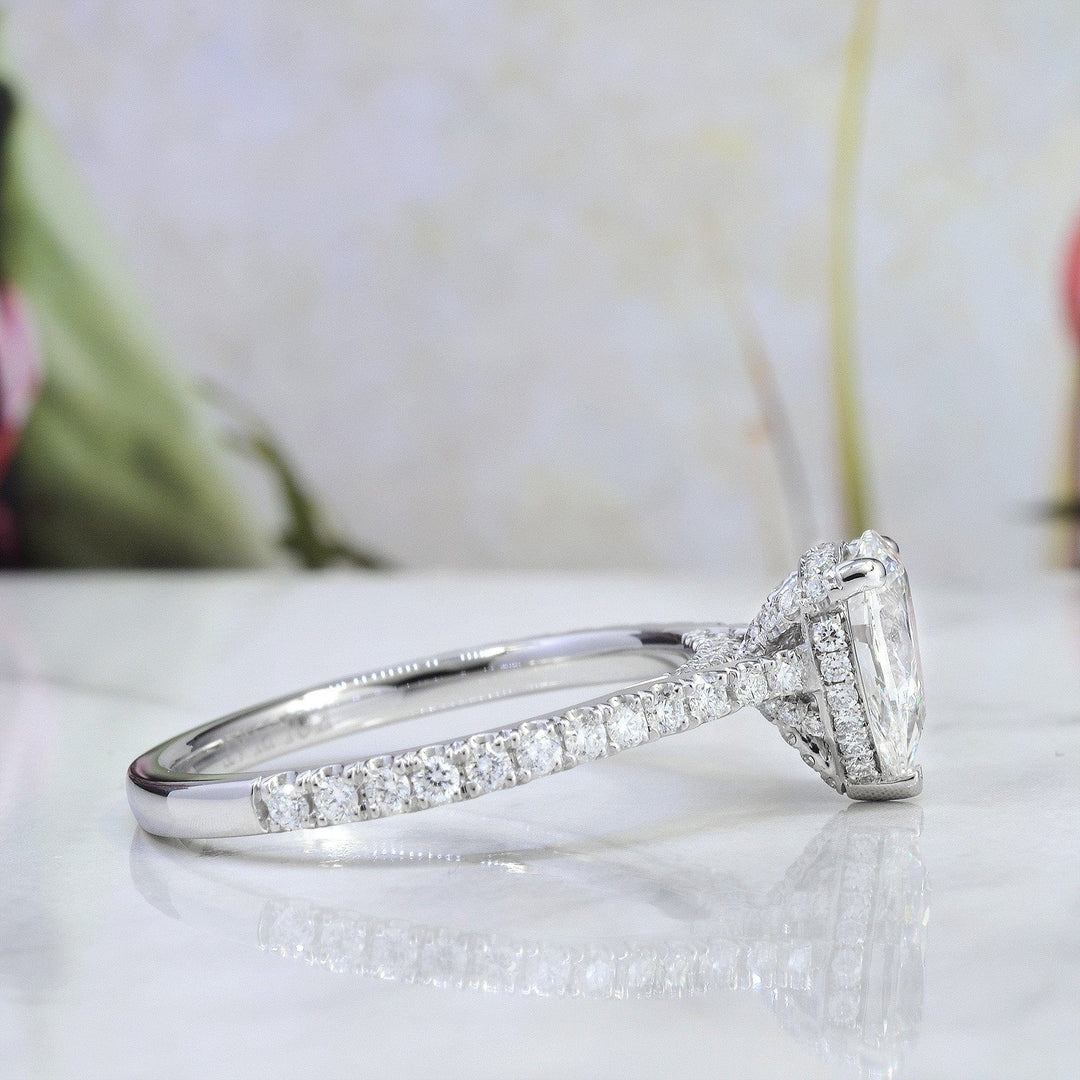 Hidden Halo Pear Engagement Ring Sitting