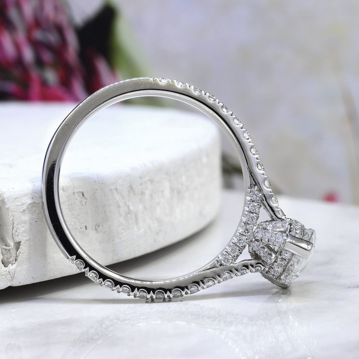Hidden halo pear engagement ring side profile