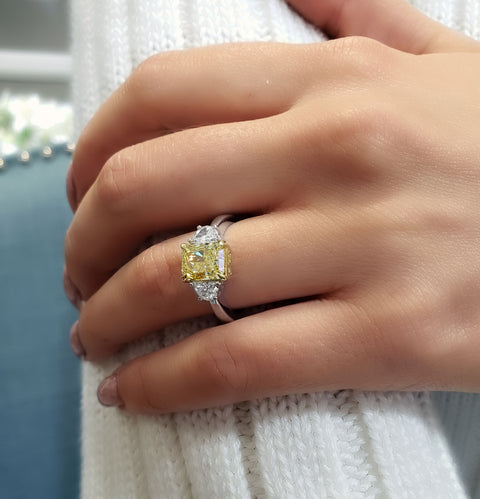 Yellow Radiant Diamond Ring with Half Moons on hand