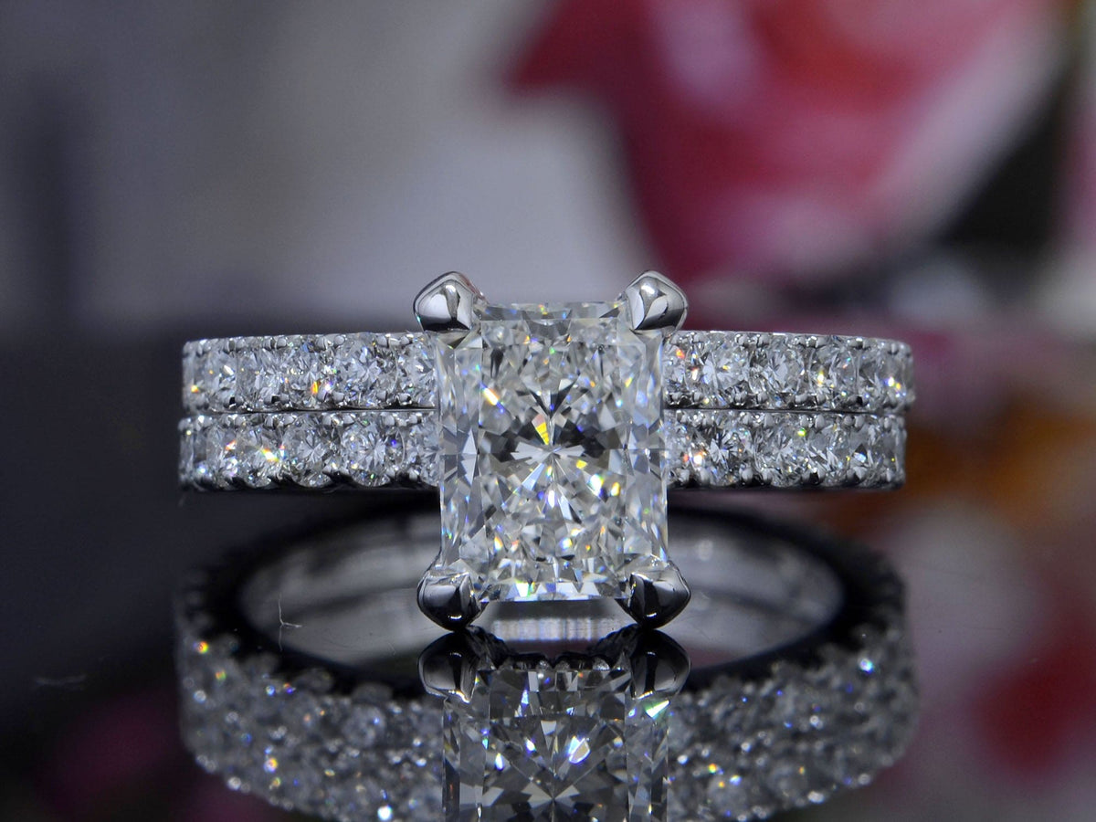 Radiant cut hidden halo engagement ring set