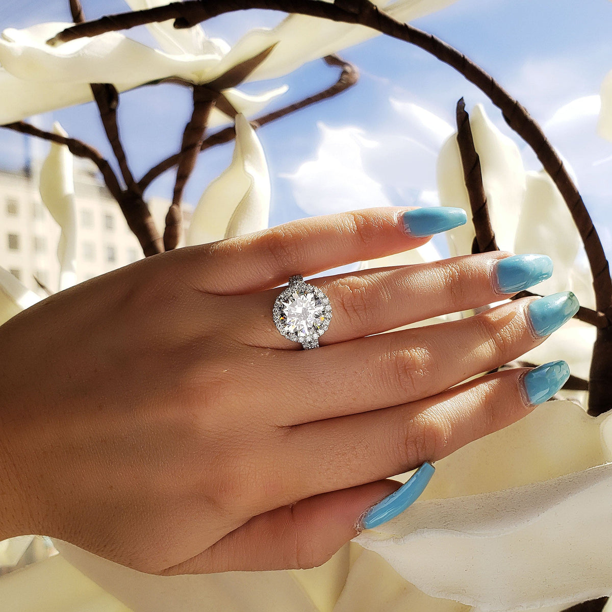 Halo split shank round cut diamond ring on hand