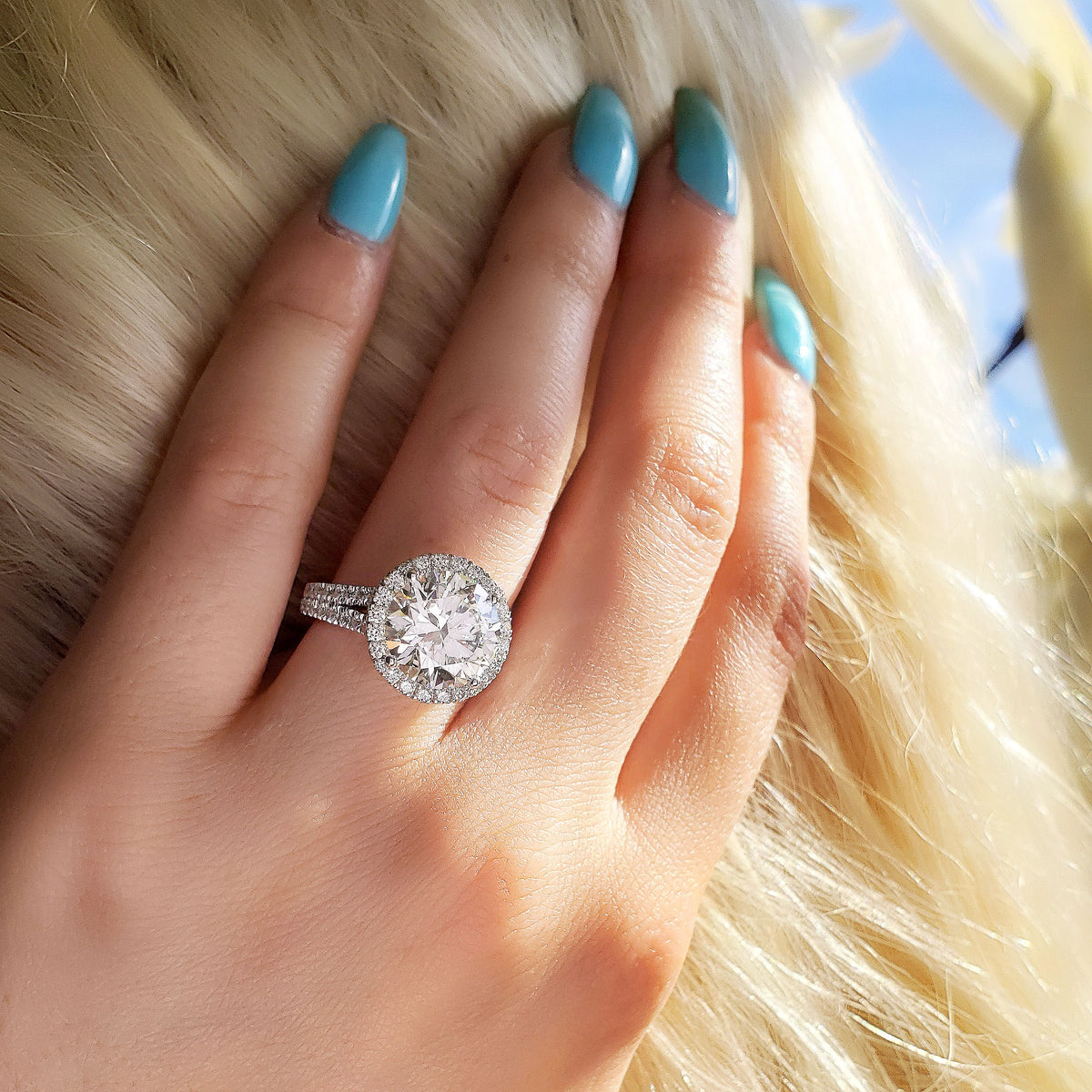 Halo split shank round cut diamond engagement ring 