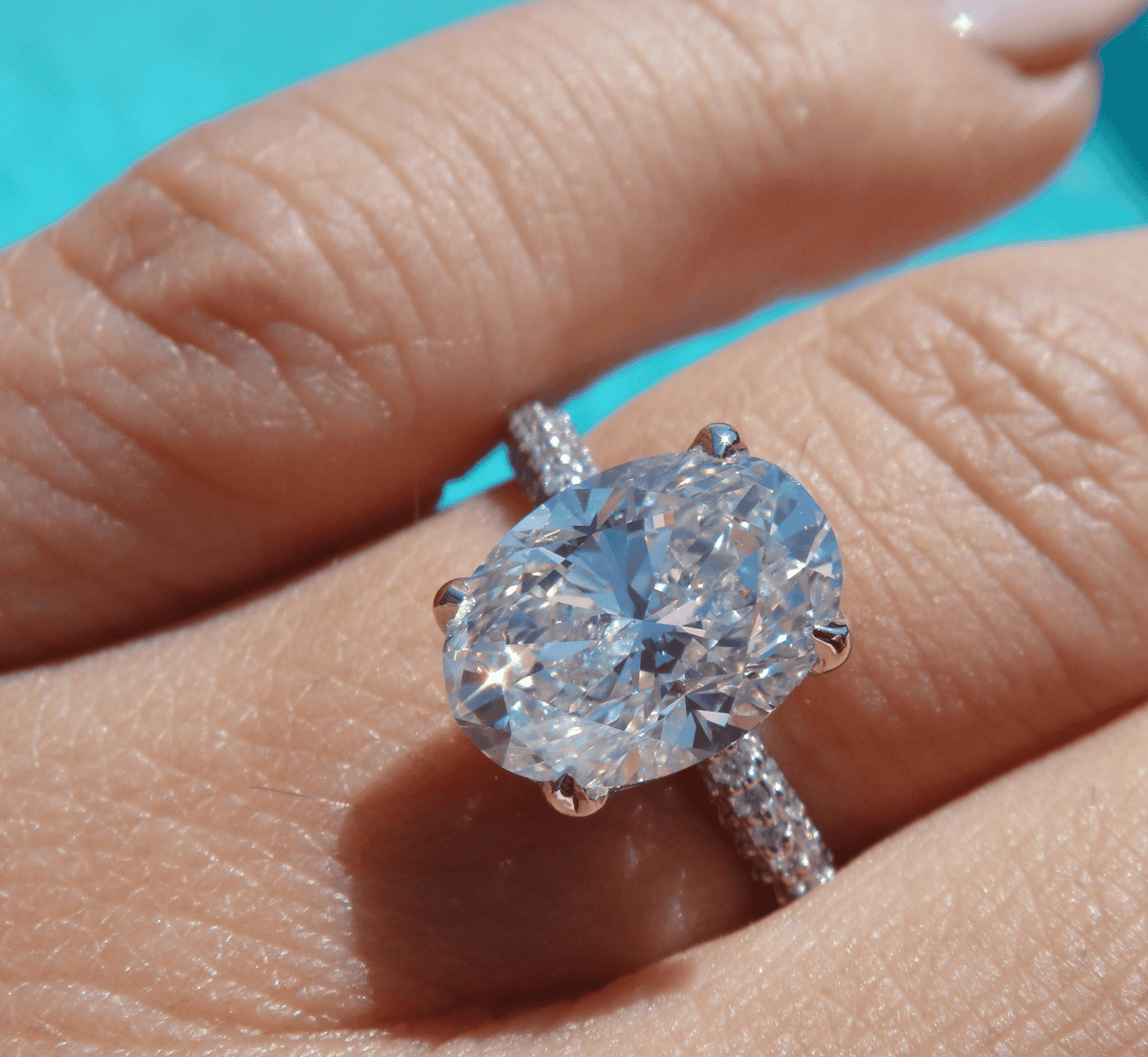 Hidden halo oval engagement ring