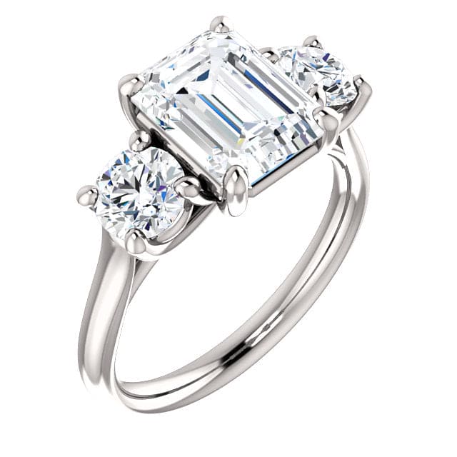 3 stone emerald cut engagement ring with rounds