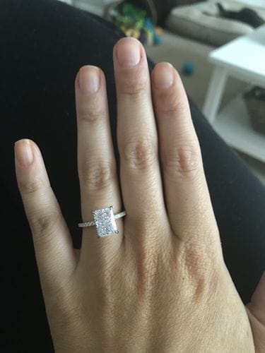 Radiant Cut Engagement Ring With Side Stones on Hand