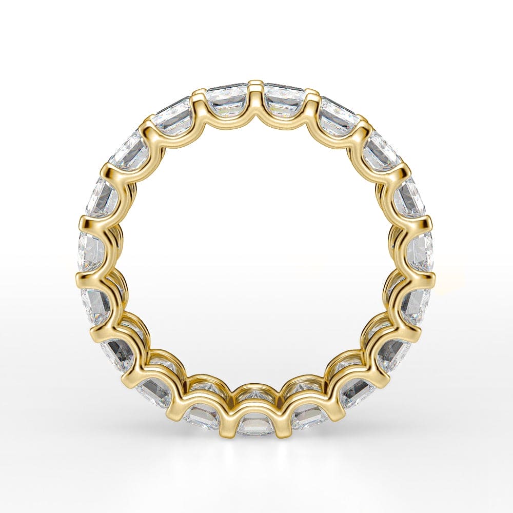 6 carat emerald cut eternity band Yellow Gold