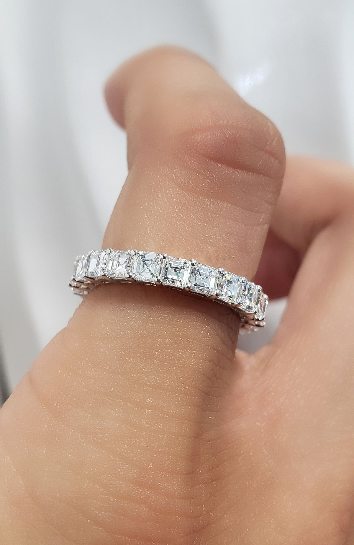 Asscher cut eternity ring   view on finger