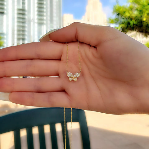 yellow gold diamond bow necklace