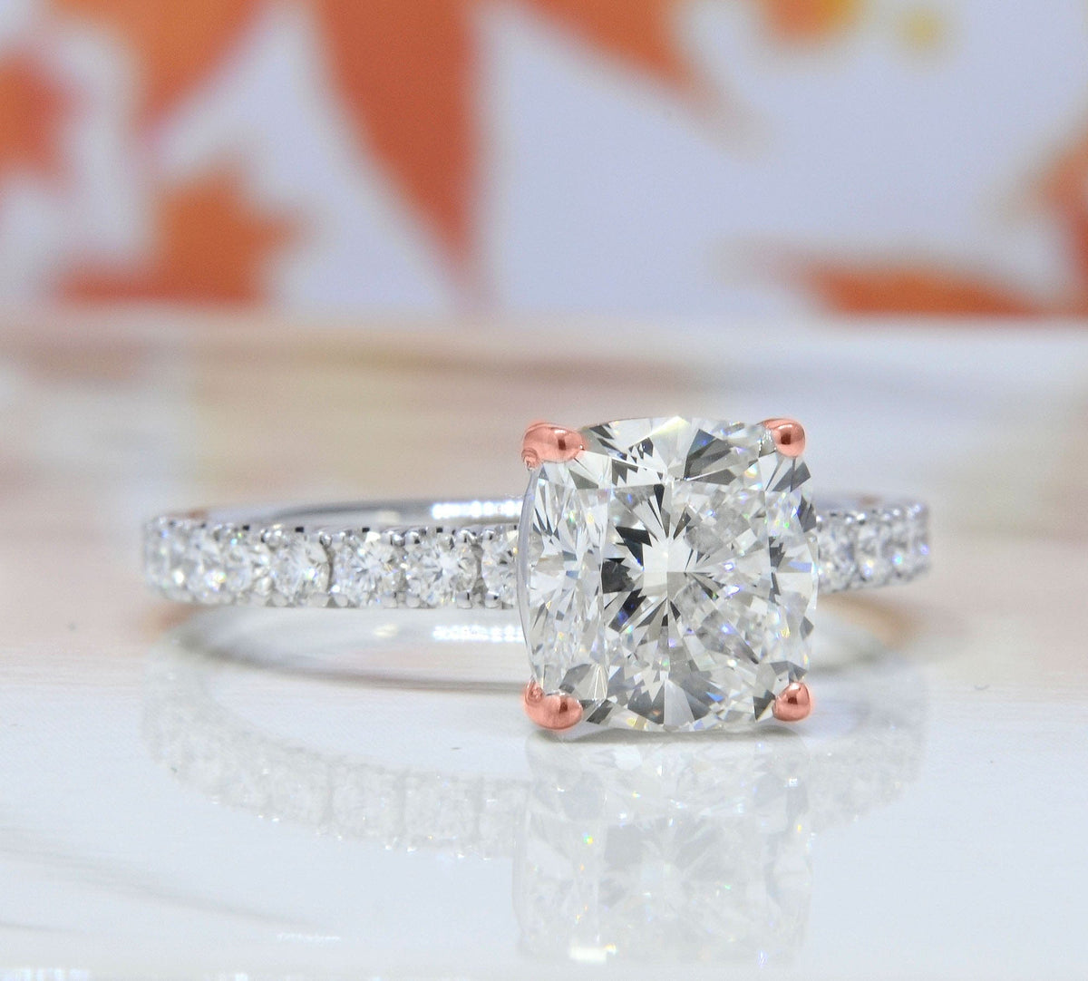 Cushion cut hidden halo engagement ring