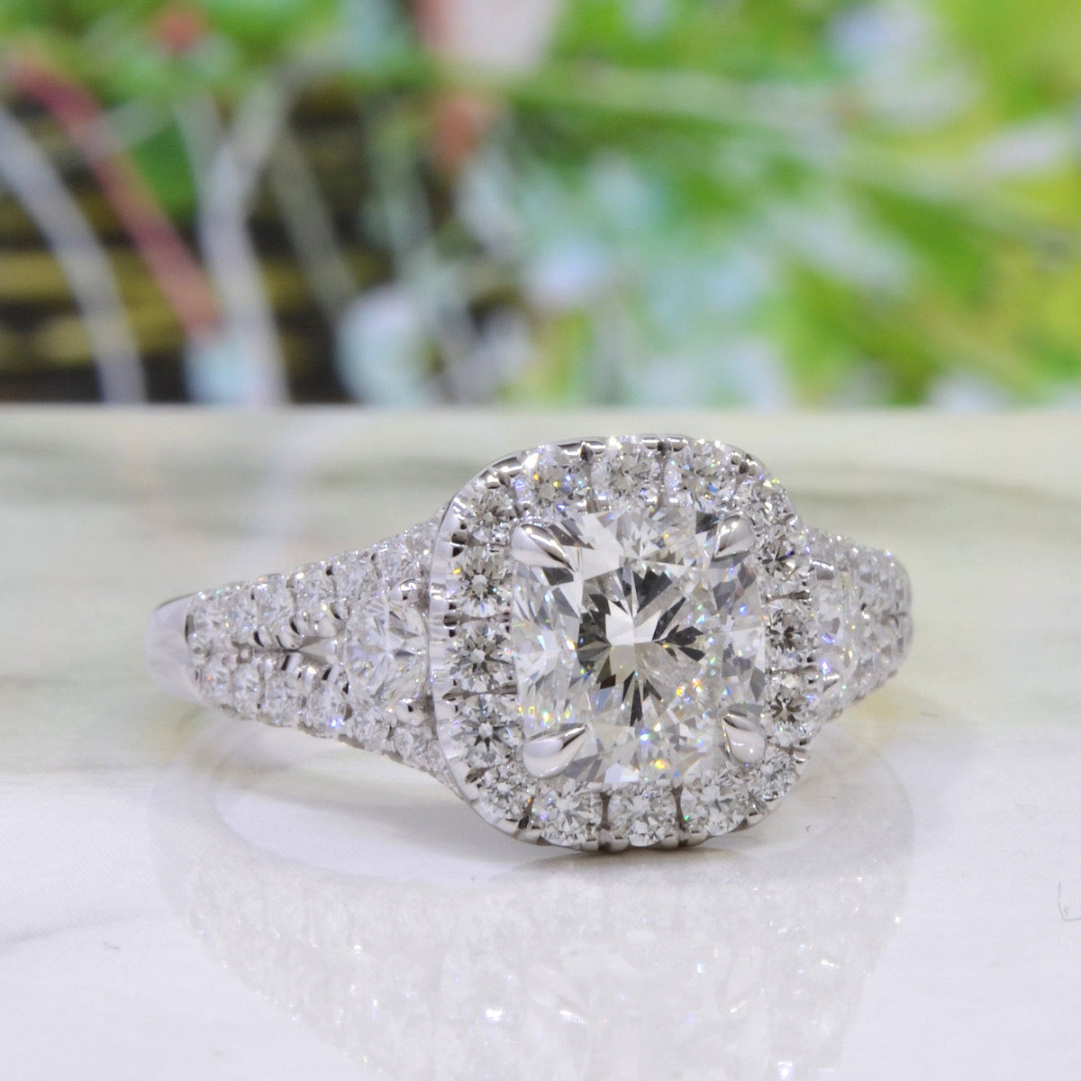 Halo cushion split shank engagement ring