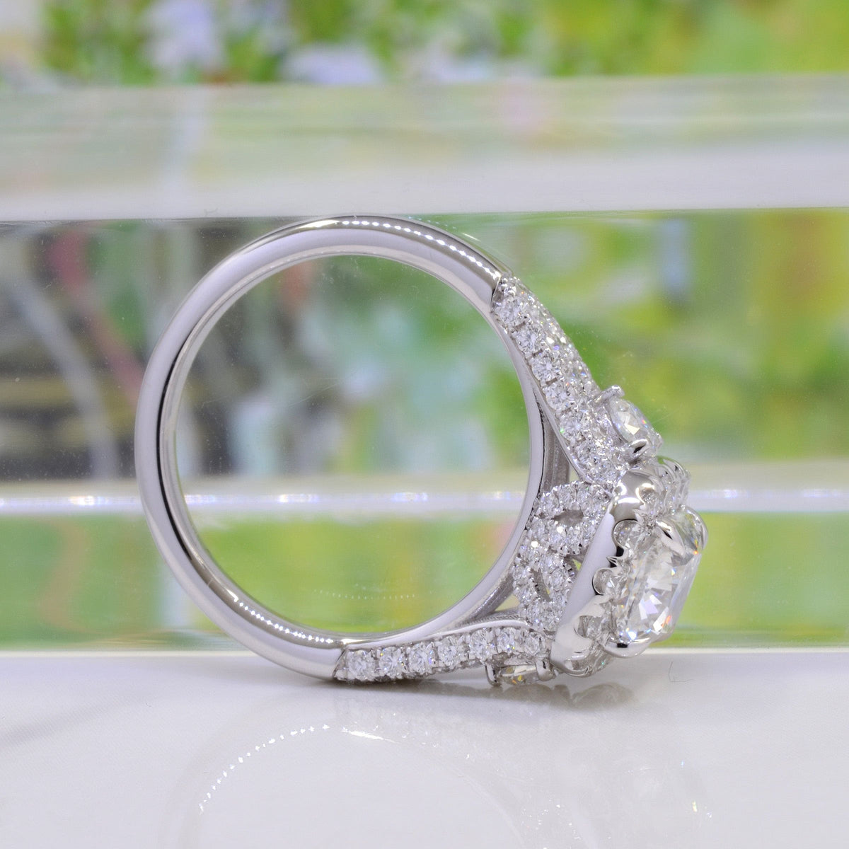Halo cushion split shank engagement ring side profile