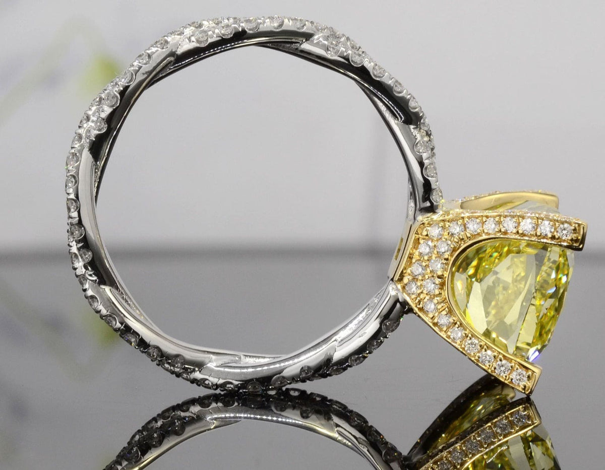 Fancy yellow cushion cut twisted engagement ring profile view