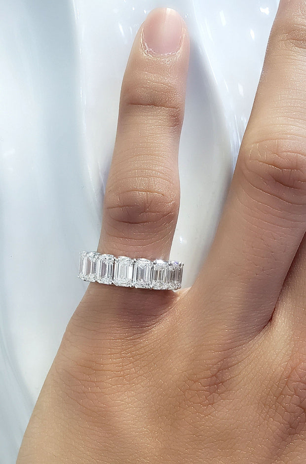 7 Carats Emerald Cut Eternity Ring on Pinky 