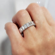 7 Carats Emerald Cut Eternity Ring on hand