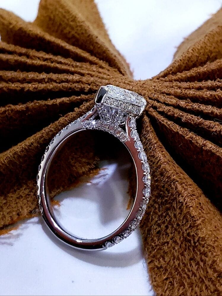 Hidden halo pear engagement ring side profile