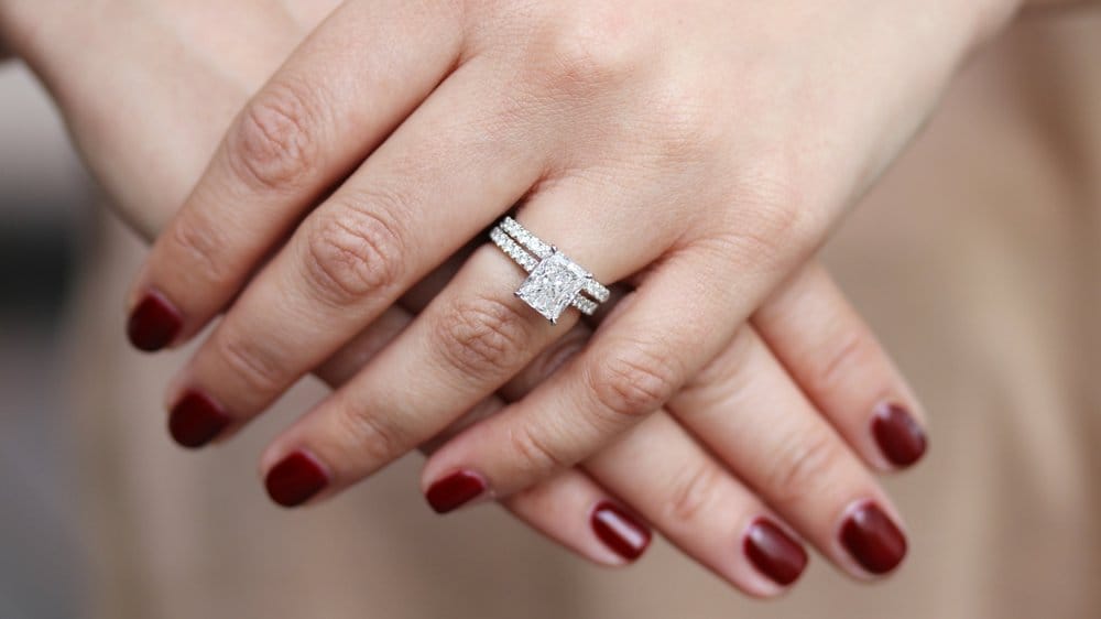 Radiant cut engagement ring eternity on hand