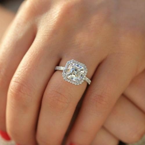 Halo asscher cut engagement ring on hand