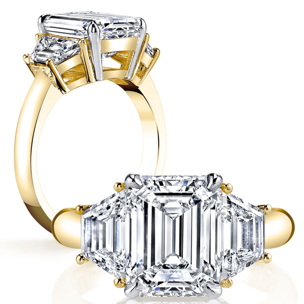 3 stone emerald cut engagement ring yellow gold
